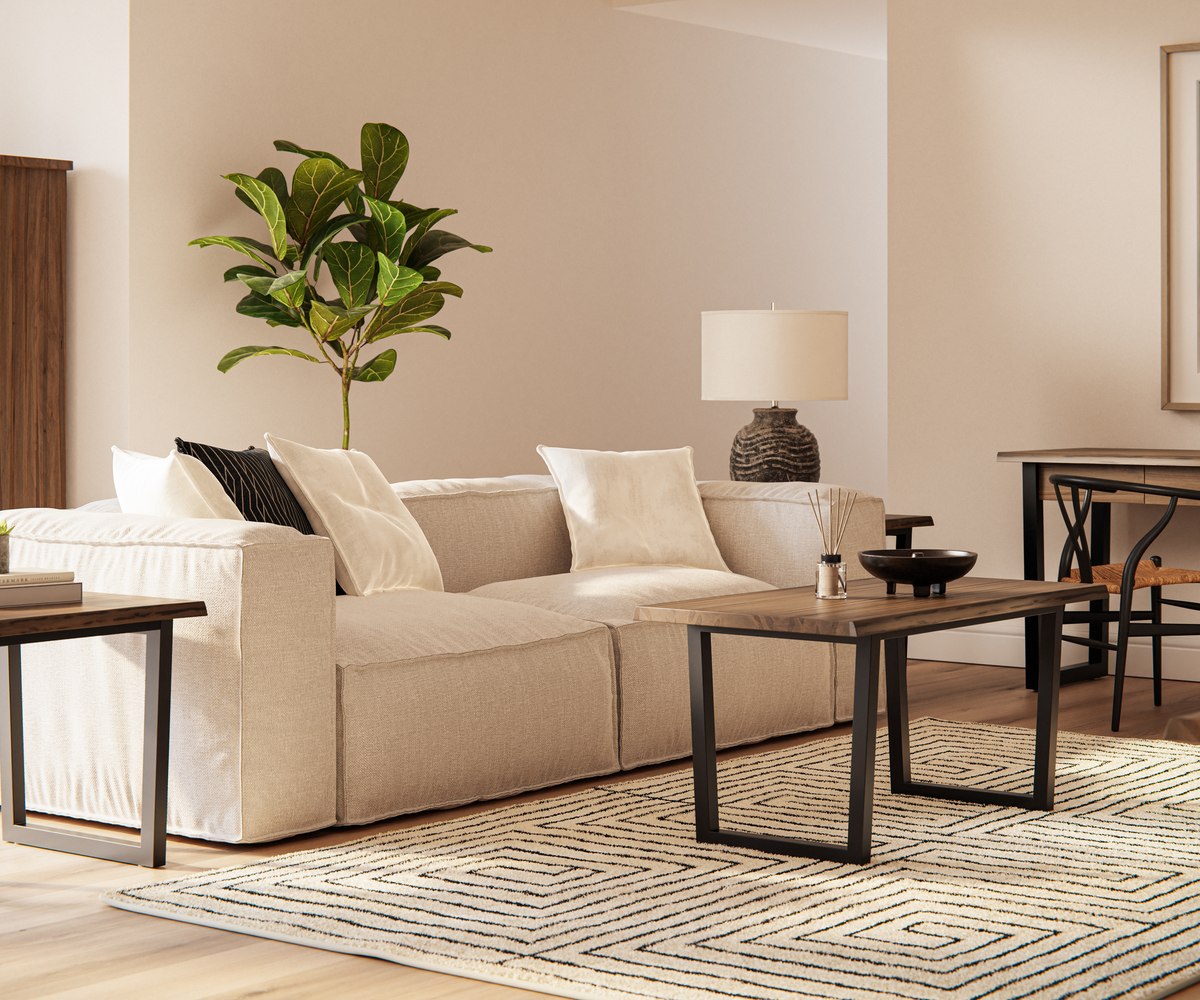 Bright living room with a cream sofa and coordinating wood coffee and end tables.